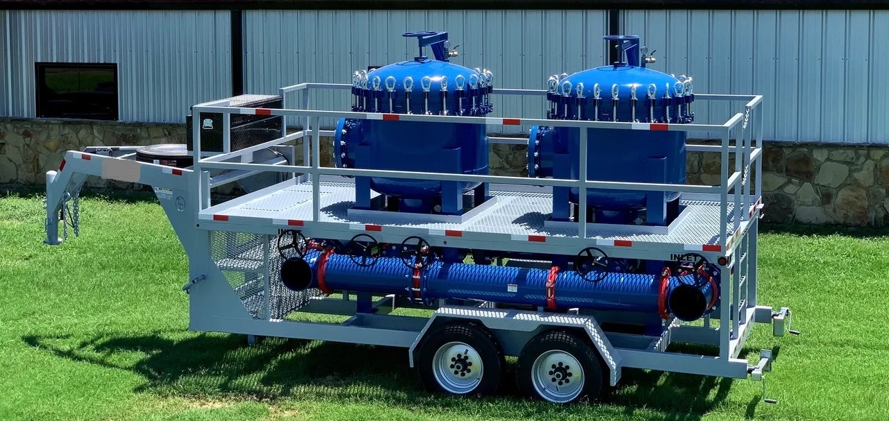 Mobile trailer with twin 25 cell bag housings in 304 SST with duplexed 12" piping capable of filtering up to 9,000 GPM. 